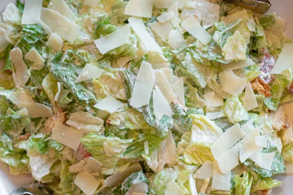 Romaine lettuce, croutons, grated parmesan, lemon wedge, house Caesar dressing dressing on the side
